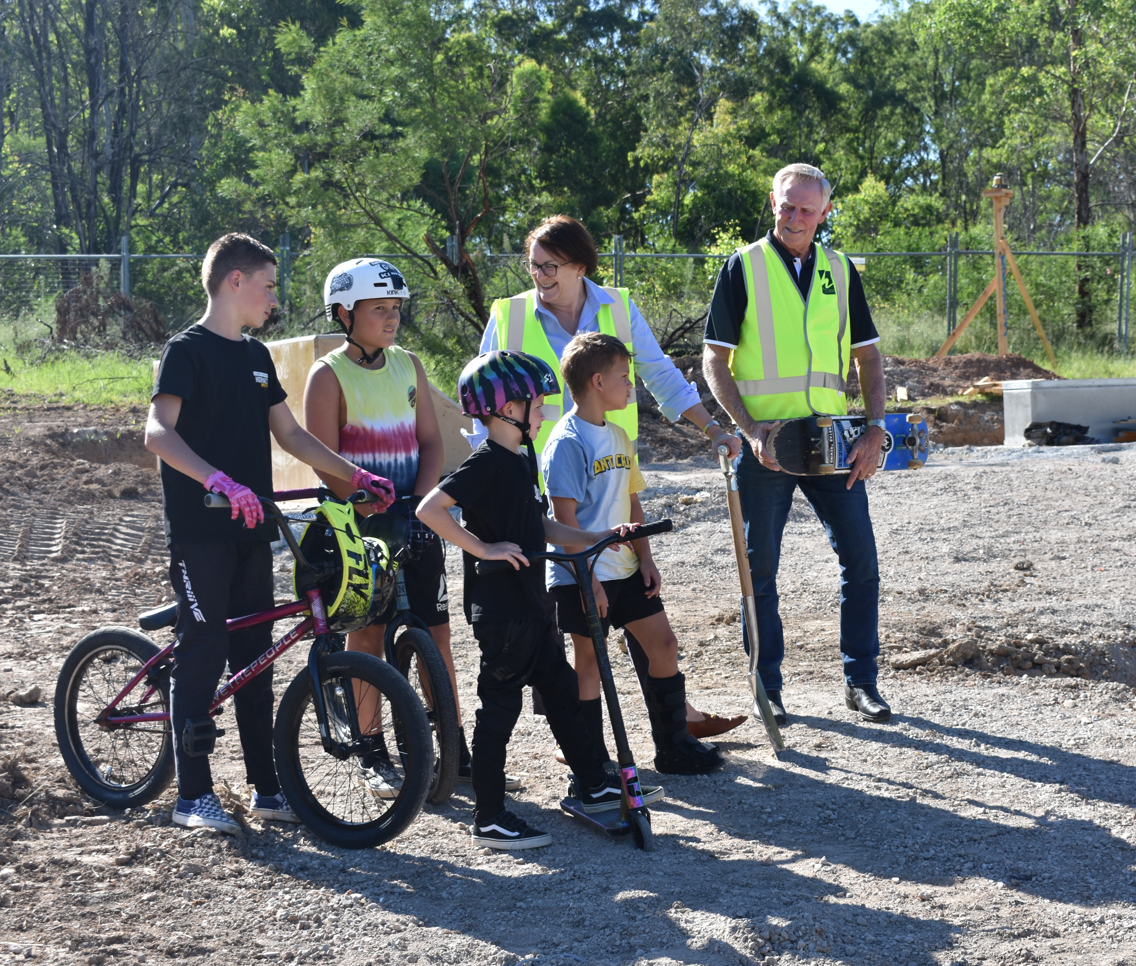 Mayor, Susan Templeman MP and local kids looking at the start of construction on the Woodbury Reserve Skate Park