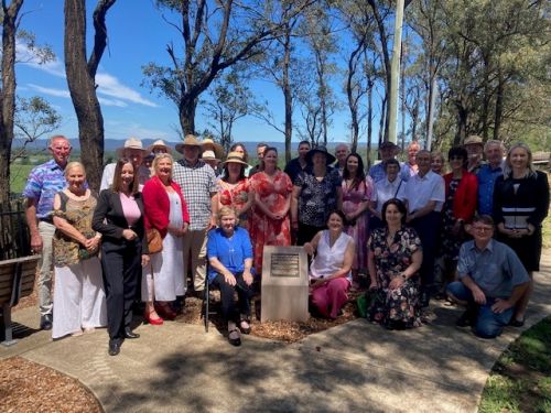 Image of family, friends and dignitaries at John Miller's memorial.