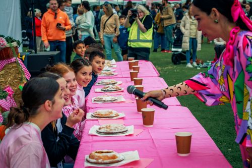 Picture of kids participating in an apple pie eating competition